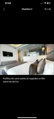 a picture of a bedroom with a bed with pillows at Villa avec piscine chauffée in Marrakech