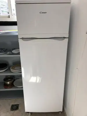 a white refrigerator in a kitchen with its door open at Chalet Authentique Au Centre-Ville in Ifrane