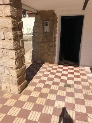 a shadow of a person standing in front of a door at Chalet Authentique Au Centre-Ville in Ifrane