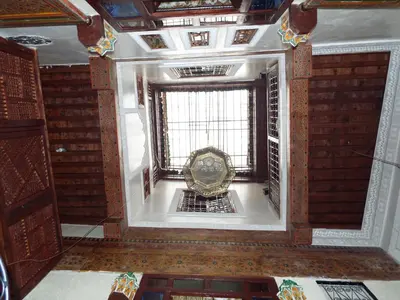 an ornate room with a window in a building at Dar Fès Huda in Fès