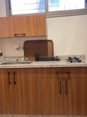 a kitchen with a sink and a counter top at Dyafat Abla in Ouarzazate