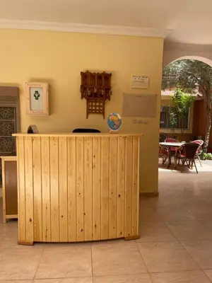 a kitchen with a wooden counter in a room at Dyafat Abla in Ouarzazate