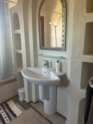 a bathroom with a sink and a mirror at Riad du Bab atlas in Marrakech