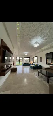 a large living room with couches and tables at Perfekt villa Marrakech in Marrakech