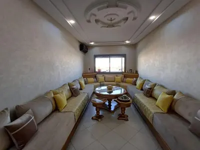a large room with a couch and a table at Dar serenity in Meknès