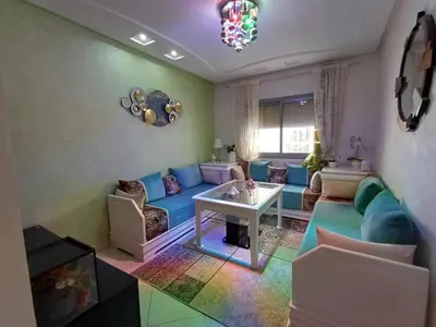 a living room with a couch and a table at Dar serenity in Meknès