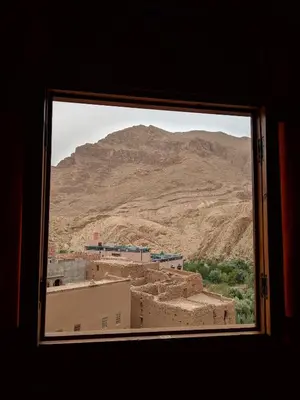 a view of a mountain from a window at Riad La Fleur in Aït Baha