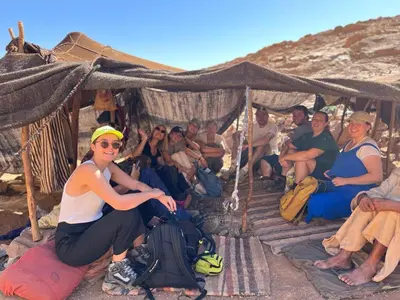 a group of people sitting under a tent at Riad La Fleur in Aït Baha