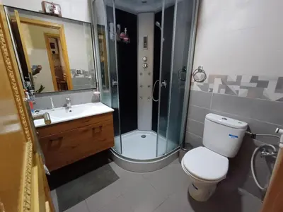 a bathroom with a shower and a toilet and a sink at Belle vacances dans mon App in Meknès