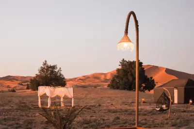 a street light in the middle of the desert at Serenity Sky Luxury Camp in Merzouga