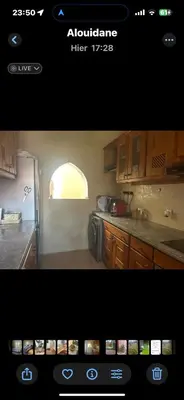 a screenshot of a kitchen with a picture of a kitchen with a refrigerator at Riad du Bab atlas in Marrakech