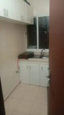 a kitchen with white cabinets and a sink at Dolce Vita Nid Douillet alias Havre de Paix O Coeur d Ifrane in Ifrane