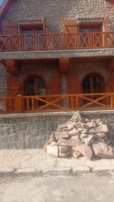 a building with a pile of rocks in front of it at Dolce Vita Nid Douillet alias Havre de Paix O Coeur d Ifrane in Ifrane