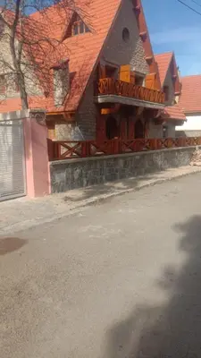 a house with a balcony on the side of a street at Dolce Vita Nid Douillet alias Havre de Paix O Coeur d Ifrane in Ifrane