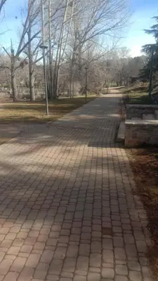 a walkway in a park with trees and a street at Dolce Vita Nid Douillet alias Havre de Paix O Coeur d Ifrane in Ifrane