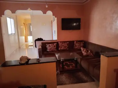 a living room with a couch and a table at Billa appart in Midelt