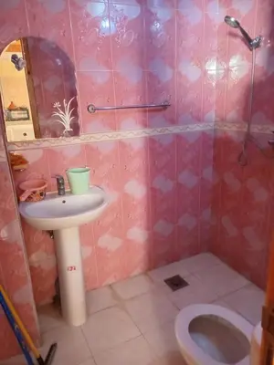 a bathroom with a sink and a toilet at Billa appart in Midelt