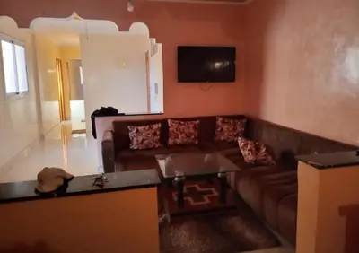 a living room with a couch and a table at Billa appart in Midelt