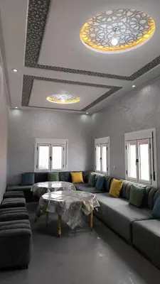 a living room with a couch and a table at Home Amazigh Serenity in Tinerhir