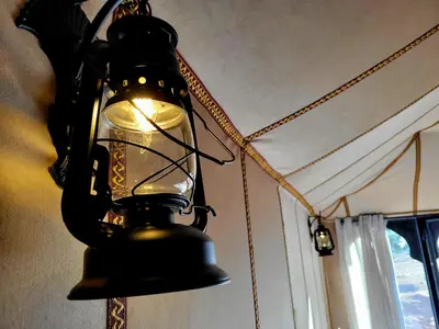 a lamp hanging from the ceiling in a room at Golden Gate Luxury in Merzouga