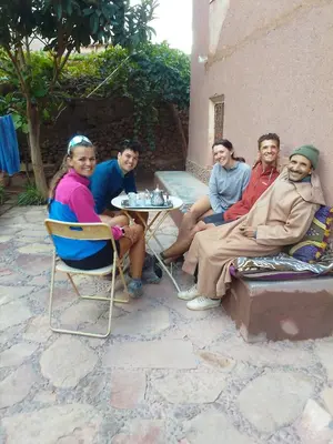 a group of people sitting around a table at Gite d'étape Chez Brahim in Kalaat MGouna