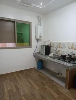 a kitchen with a counter and a sink in a room at ain chekef in Douar Oulad Mhammed