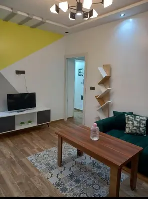 a living room with a couch and a coffee table at ain chekef in Douar Oulad Mhammed