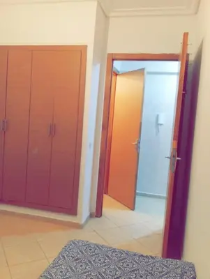 a room with two sliding doors and a hallway at Gîte du lac chez bennouri in Telouet