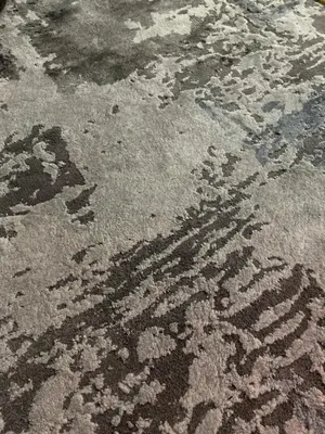 a rug on the floor with a pattern on it at Maison Dar TMMS in Khenifra