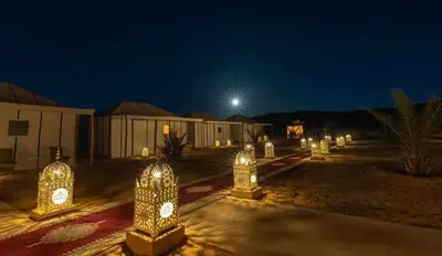 a group of lights in a yard at night at luxury camp desert ideal in Merzouga