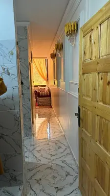 a hallway with a door leading to a living room at Dar Igri in Ourika