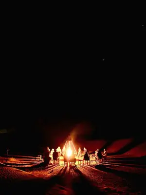 a train is on the tracks at night at Touareg spirit luxury Camp in Merzouga