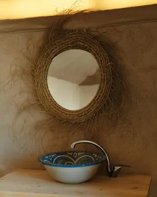 a bathroom sink with a bowl and a mirror at Infinity Camp Morocco in Mfis