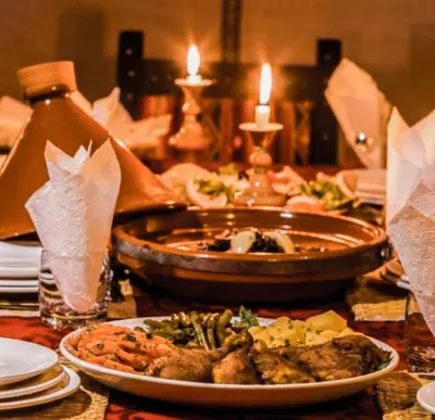 a table with a plate of food on a table at Incredible luxury Camp in Merzouga