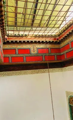 a ceiling of a building with a rope hanging from it at Dar lmallouki 2 in Fès