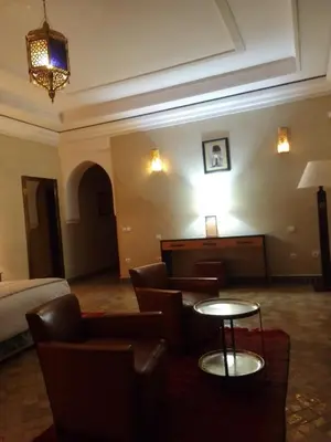 a hotel room with a couch and a table and a piano at Maria in Najem