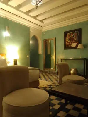 a living room with a couch chairs and a table at Maria in Najem