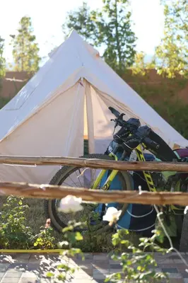 a bike parked in front of a white tent at Pikala Home in Ourika