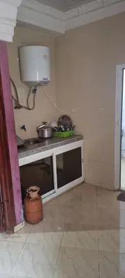 a kitchen with a counter and a sink in a room at منزل باهية in Moulay Yacoub