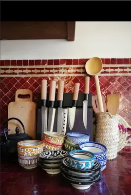 a group of bowls and utensils on a counter at Appartement privé Medina in Fès