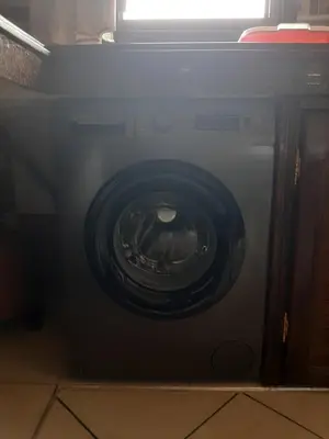 a black microwave oven with its door open at Appartement Fascinant à Meknès in Meknès