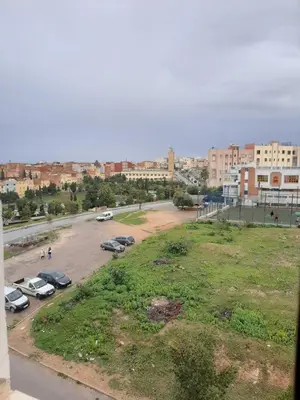 a view of a parking lot in a city at Appartement Fascinant à Meknès in Meknès