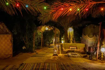 a living room with a couch and some lights at Sahara Garden Luxury Camp in Merzouga