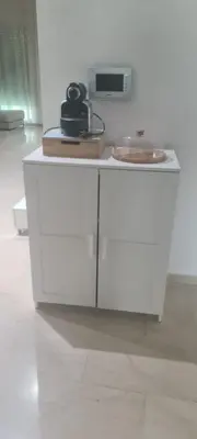 a white table with a bowl on top of it at Villa in Fès