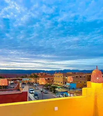 a view of a city with buildings and a street at Riad Dar Sahara - Panoramic Rooftop in Nkob