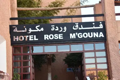 a sign for a hotel rose mycano on a building at Hôtel Rose Mgouna in Kalaat MGouna