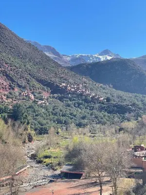 a view of a valley with a river and mountains at Dar Itri in Ourika
