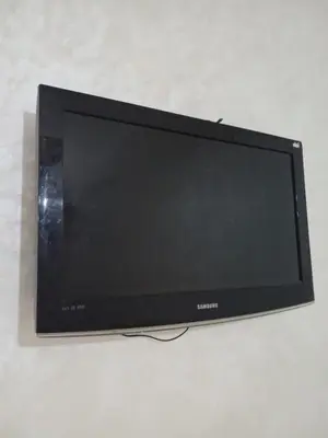 a flat screen tv sitting on top of a table at Appartement in Fès