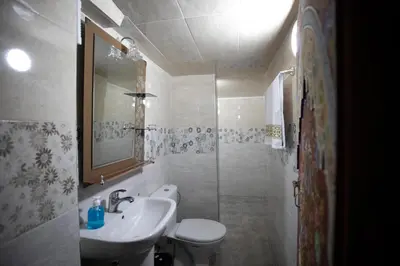 a bathroom with a sink and a toilet and a shower at Dar Amazigh in Fès