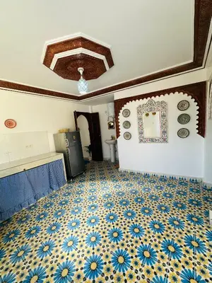 a room with a blue and white tile floor at Maison Berber in Ourika